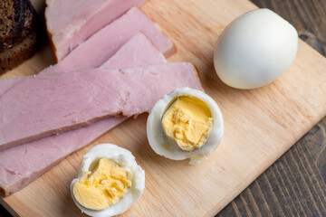 Boiled chicken egg with sliced pieces of meat
