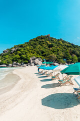 Fototapeta na wymiar White beach and seaside chairs,relax in summer