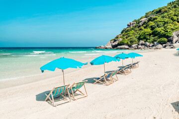 Fototapeta na wymiar White beach and seaside chairs,relax in summer