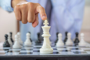 hand moves chess with strategy and tactic to win enemy, play battle on board game, business opportunity competition strategic challenge concept