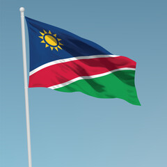 Fototapeta na wymiar Waving flag of Namibia on flagpole. Template for independence day
