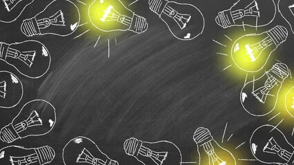 Set of flickering tungsten light bulbs drawn in chalk on a blackboard. Concept of brainstorming process.