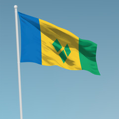 Waving flag of Saint Vincent and the Grenadines on flagpole. Template for independence day