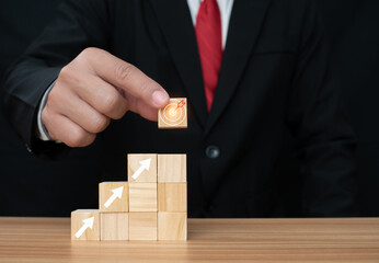Wood cube block stacking with icon.Concept of business strategy and goal action plan.