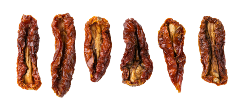 Dried or Sundried tomato halves. Sun-dried tomatoes isolated on white background. With clipping path. Full depth of field. Focus stacking