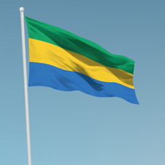 Waving flag of Gabon on flagpole. Template for independence day