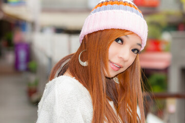 Asian American Woman in beanie cap