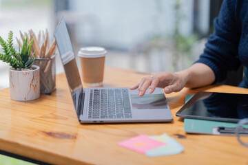 Beautiful hand working with laptop in the office.