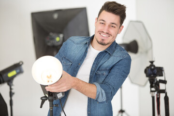 male photographer preparing his studio