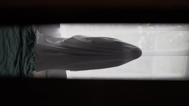 Ghost standing in a room near the window. Halloween concept