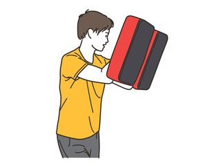 格闘技のミットを持つ若い男性コーチ