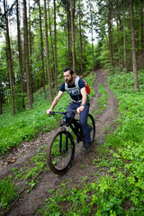 Fototapeta na wymiar man on a mountain bike in the forest