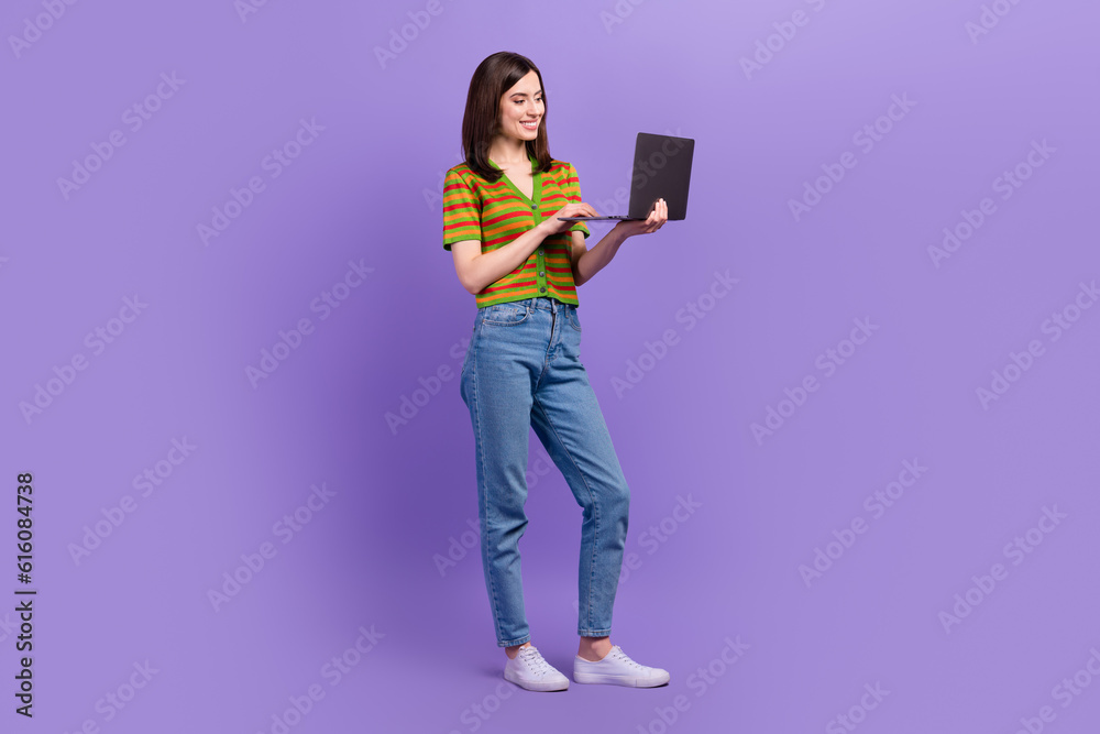 Sticker Full length photo of gorgeous adorable lady wear stylish outfit hold netbook writing typing sms email isolated on purple color background