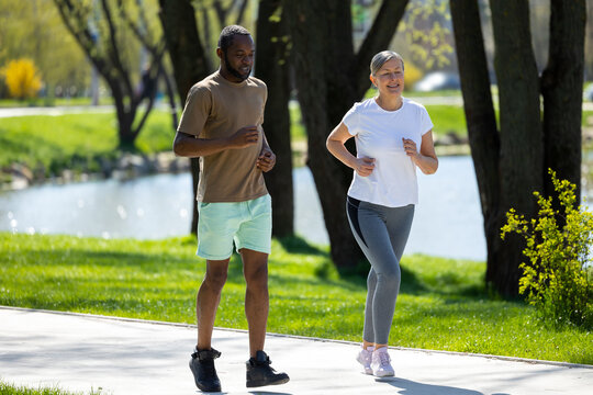 Man and woman having a morning run together in the park