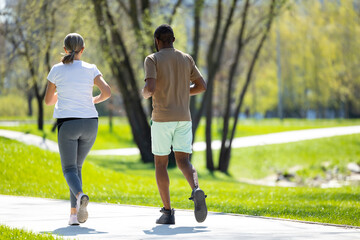 Mature couple jogging in the park in the morning