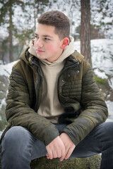 Fototapeta premium A boy is standing in the spring park.