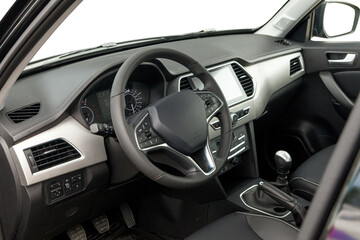 Interior of prestige modern car. Front seat with display, steering wheel and dashboard