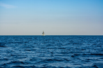Sailboat in the sea in the evening sunlight at Aarhus, Denmark