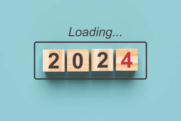 2024 new year loading. Wooden cubes with 2024 on a blue background. 3d rendering.