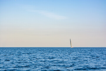 Sailboat in the sea in the evening sunlight at Aarhus, Denmark