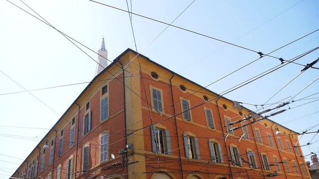 An Old House and Numerous Electric Wires on the Street