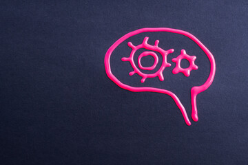 Human brain with gears. Abstract brain drawing of pink color on black background. Rational thinking, information processing, creative concept.