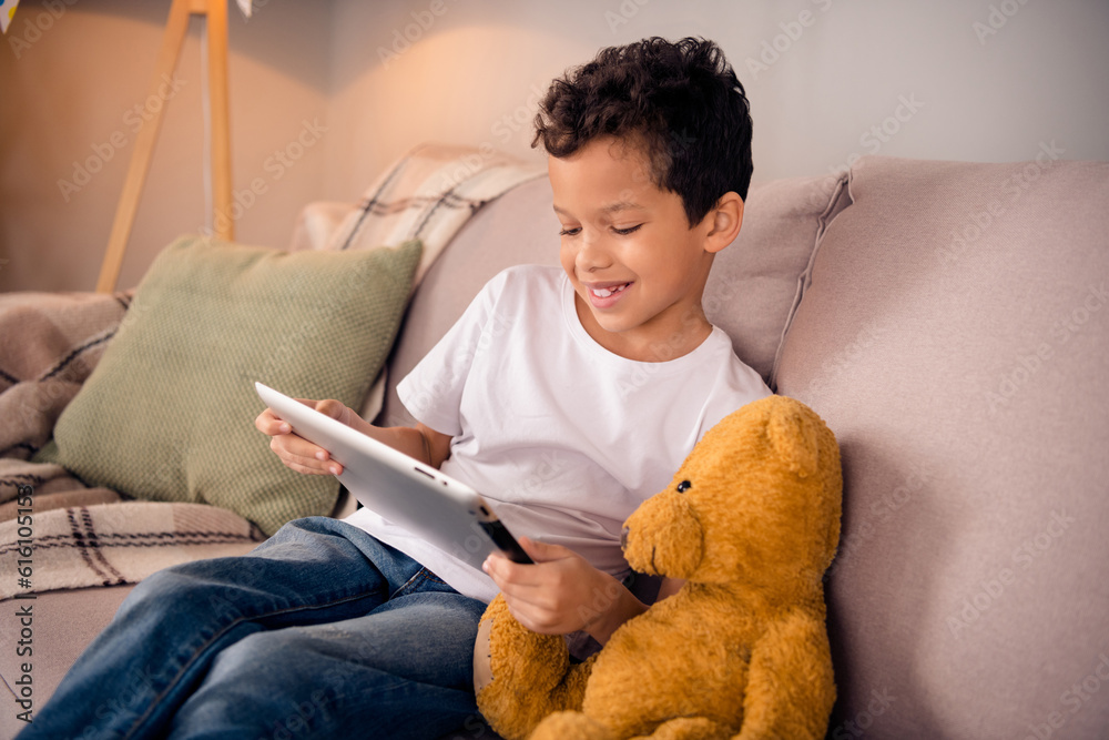 Sticker portrait of charming happy small boy plushie watching movie wear white shirt stylish bright child ro