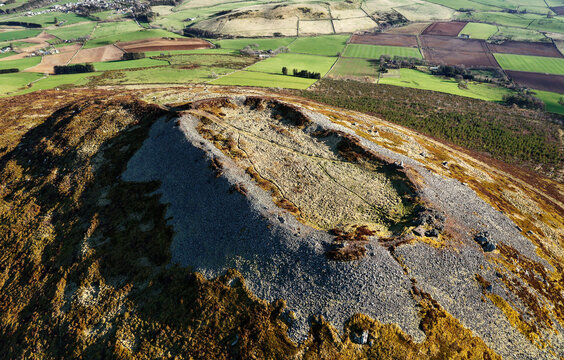 Tap o&rsquo; Noth prehistoric hillfort Grampian, Scotland. Massive vitrified wall of Neolithic core. Outer rampart encloses large early Medieval settlement