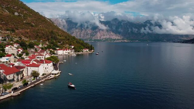Above view of coastal historic landscape town Kotor, Cattaro and Kotor bay, Boka Kotorska in Montenegro. Famous travel destination in Europe. Drone flying over Adriatic fjord