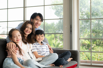 A boy and a daughter from an asian family.