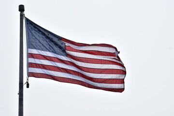 American flag waving on windy day