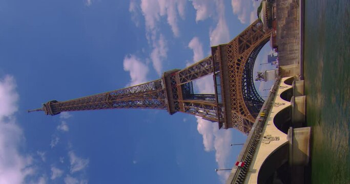 Vertical video famous square with Eiffel tower in the background time lapse. Trocadero and Eiffel tower are the most visited attractions of Paris. Hyperlapse. Cumulus clouds in the background