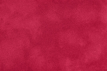 Fototapeta premium Texture of velvet dark red matte background, macro. Suede fabric with wine pattern.