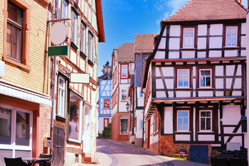 Fototapeta na wymiar street of historic building, beautiful facade ancient half-timbered house of European German architecture, wood patterns, historic building, cultural heritage, traditional town, architectural landmark