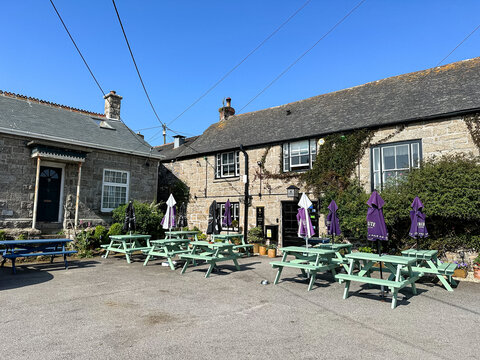 Paul, Penzance, UK - 29.05.2023. The Kings Arms pub facade in Paul, Penzance, Cornwall, England. Facade of pub in Paul, Penzance, Cornwall, UK. Summer in UK. Benches in front of the pub