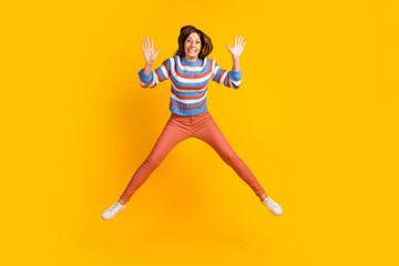 Fototapeta na wymiar Full length body size of glad cheerful girl jumping having fun isolated on bright vivid shine vibrant color background
