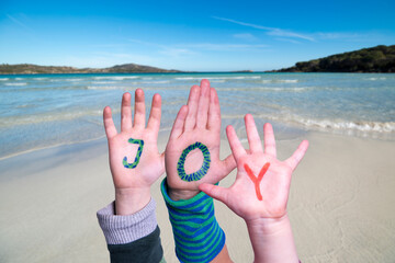 Children Hands Building Word Joy, Ocean And Sea