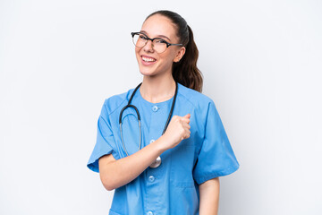 Young caucasian surgeon doctor woman isolated on white background celebrating a victory