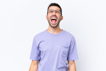 Young caucasian man isolated on white background shouting to the front with mouth wide open