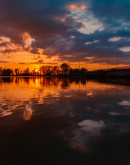 Sunset with reflections near Plattling, Isar, Bavaria, Germany