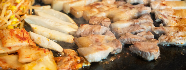 Fresh and delicious iron pan-fried black pork meal in Jeju Korean restaurant.