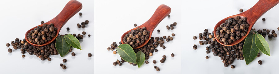 peas of black pepper in a wooden spoon with young pepper leaves on a white background