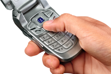 Holding a flip phone style cell phone