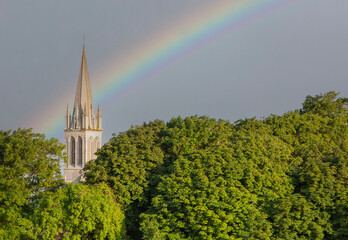 Rainbow over a church in france