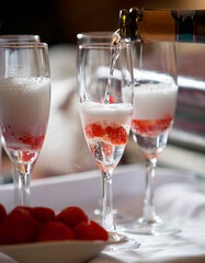 Pouring champagne into glasses 