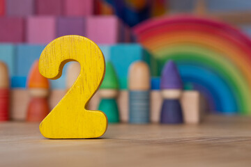 Wooden two on rainbow background of toys