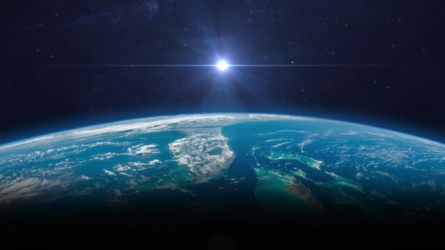 Sunrise from space.  Sunrise over blue planet Earth, view from space. View of the Earth, nebula and star. Solar system element. 4k resolution. Elements of this video furnished by NASA.