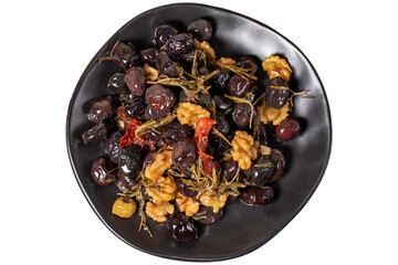 Mixed black olives. Special mixed olives prepared with dried red pepper, sun-dried tomatoes, thyme, walnuts and rosemary isolated on white background. Top view