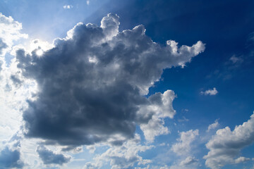 Cloudy sky with upcoming rain showers above Sauerland, Germany. Panoramic view with dramatic...