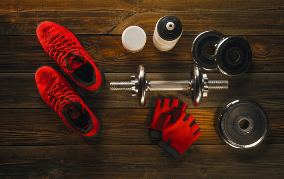 Sports equipment on a black background. Top view. Motivational.